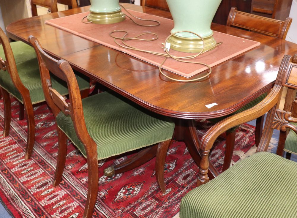 A mahogany twin pedestal dining table, (one spare leaf) L.216cm, D.94cm, H.71cm